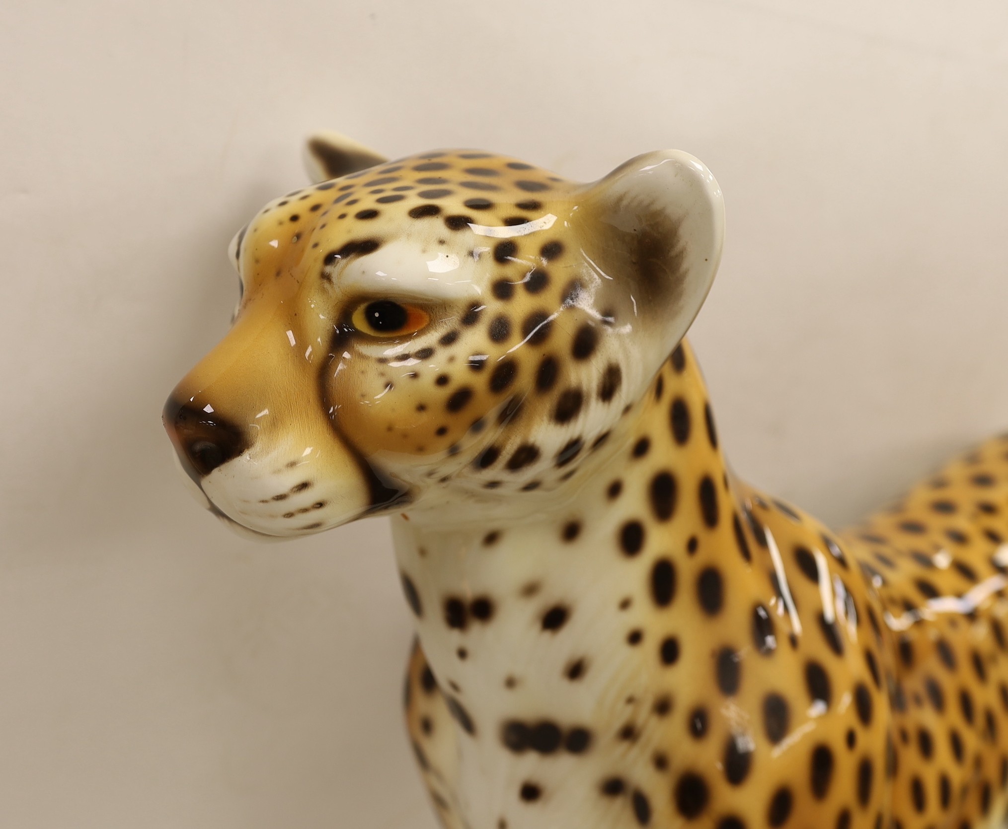 A large novelty ceramic leopard, 69cm tall